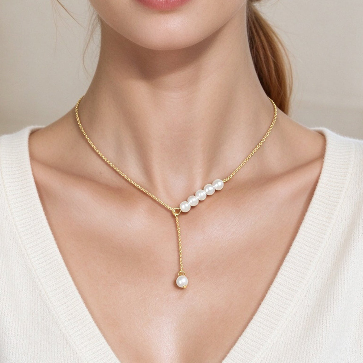 Gold Y-shaped adjustable necklace with pearl cluster and drop pearl