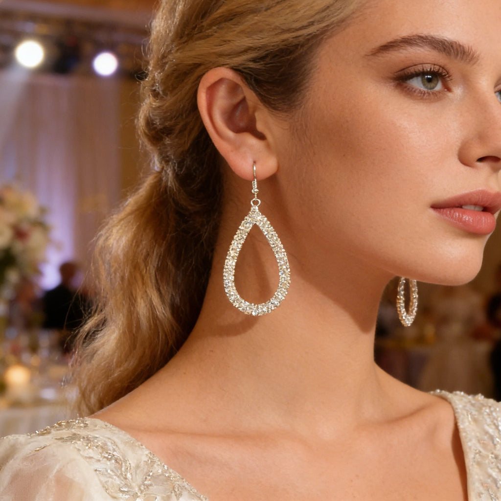 Silver crystal teardrop drop earring on model