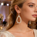 Silver crystal teardrop drop earring on model