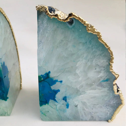 Single aqua agate bookend with gold-tone edge and teal-blue marbled stone