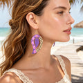Purple floral leaf dangle earrings with gold hook and piano-key border