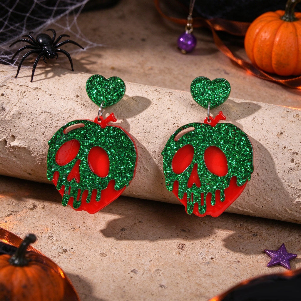 Pair of green glitter skull dangle hook earrings with red eyes and heart charm