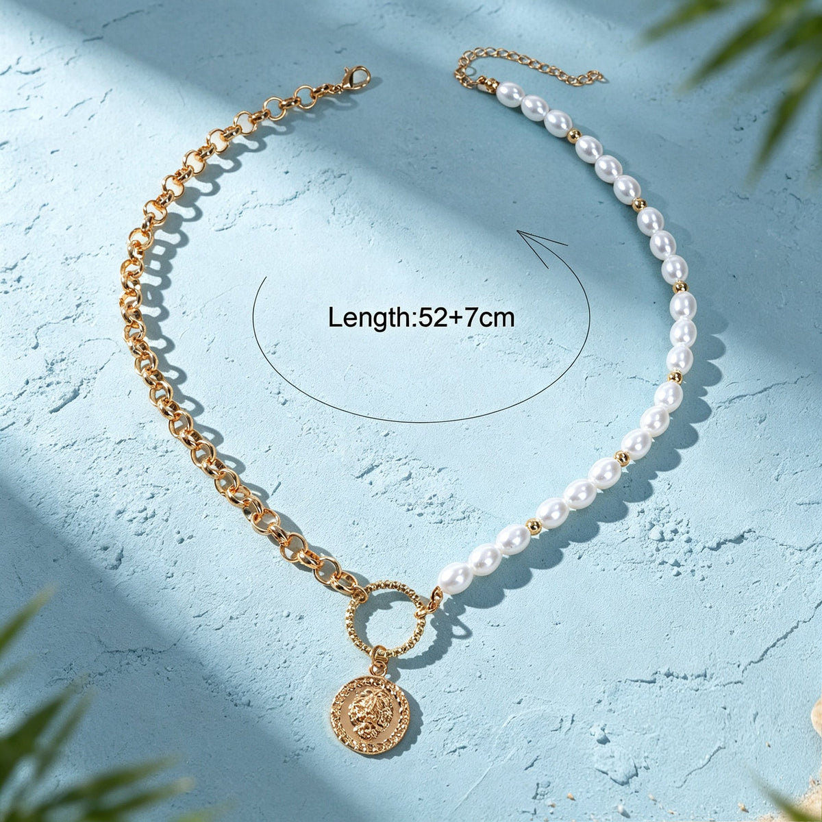 Gold-tone and faux pearl layered necklace with oval ring link and coin pendant