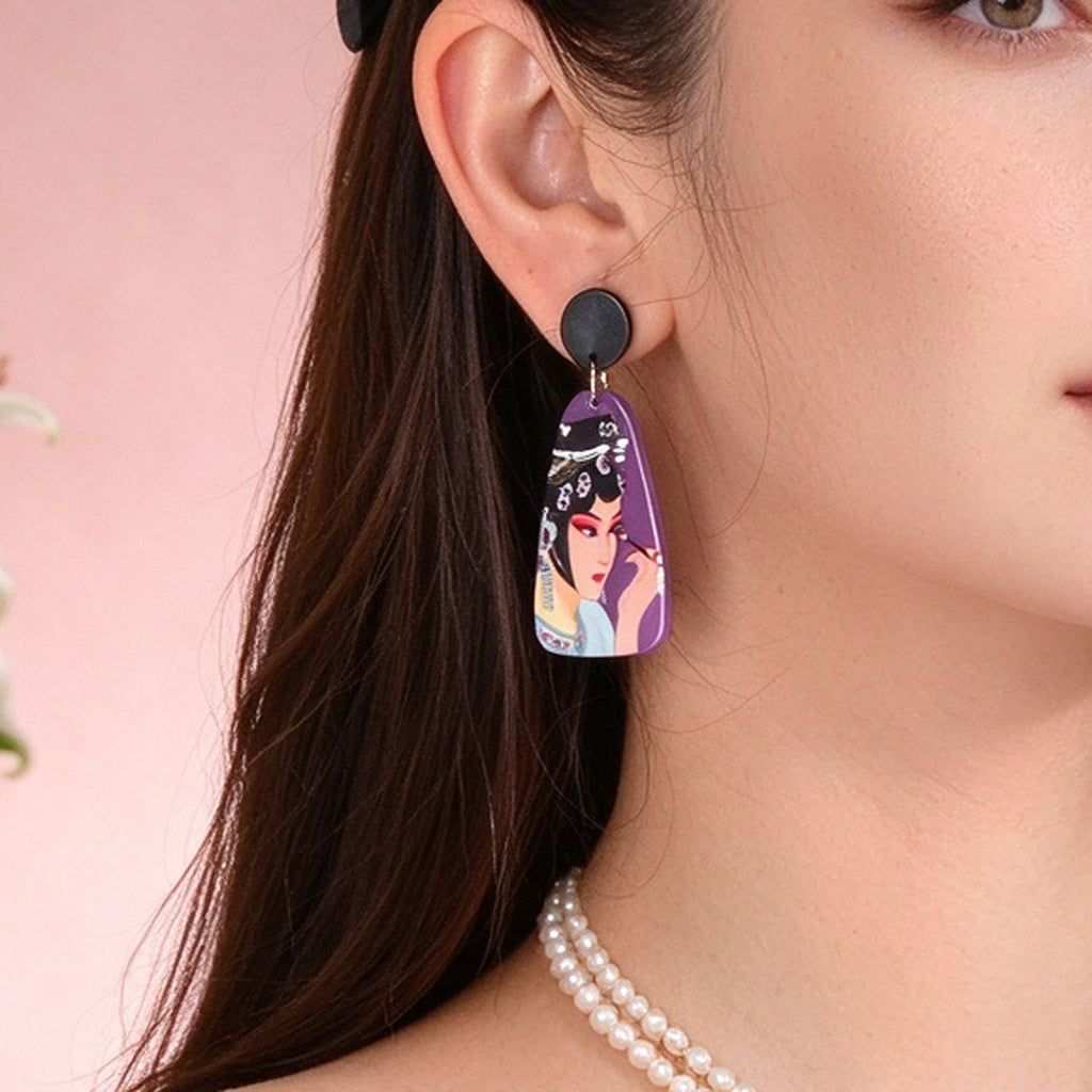 Purple opera figure dangle earrings with black round studs and portrait charm