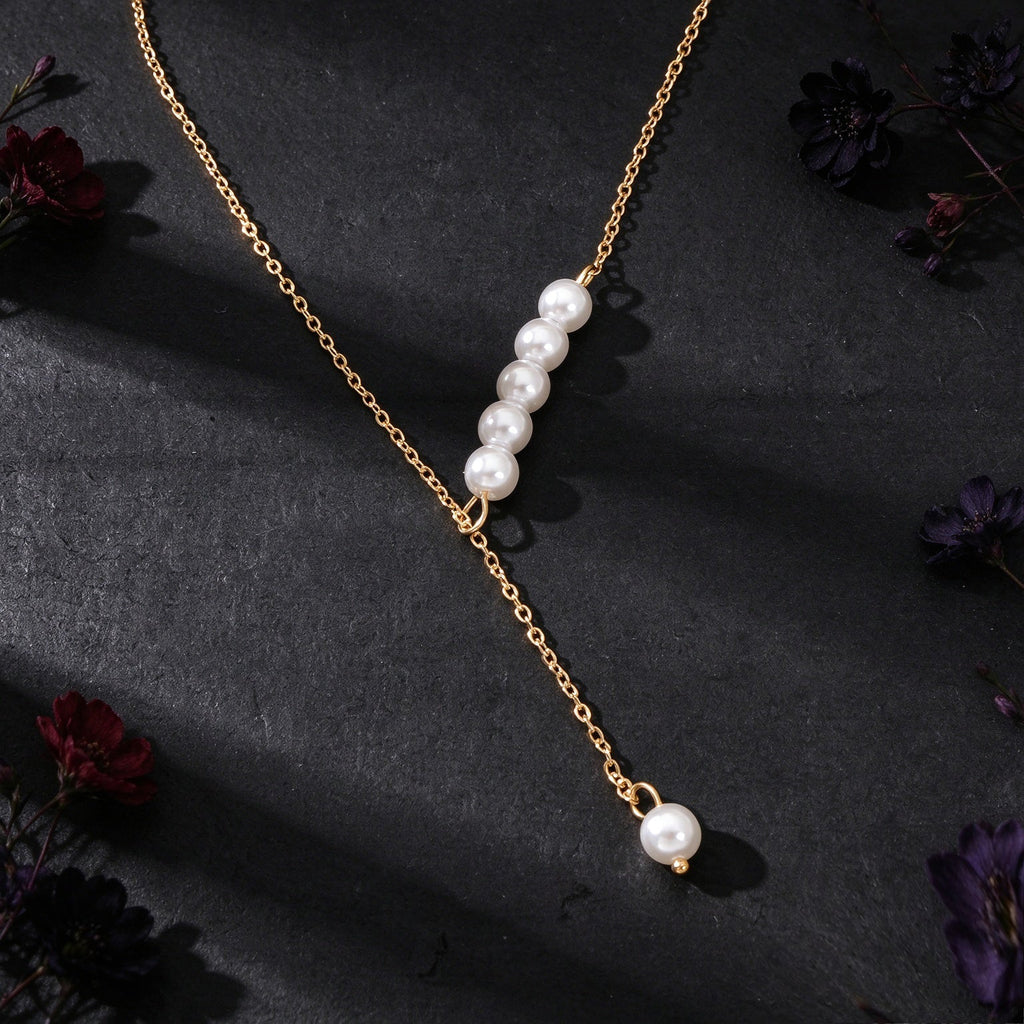 Gold Y-shaped pearl necklace with 3-bead cluster and dangling drop pearl