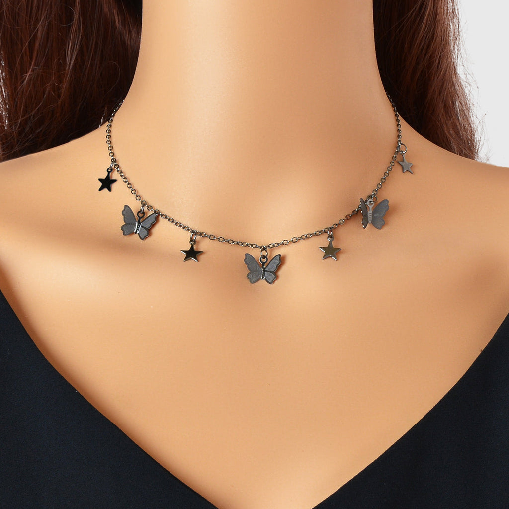Dark-tone collar necklace with star and butterfly charms, short neckline fit