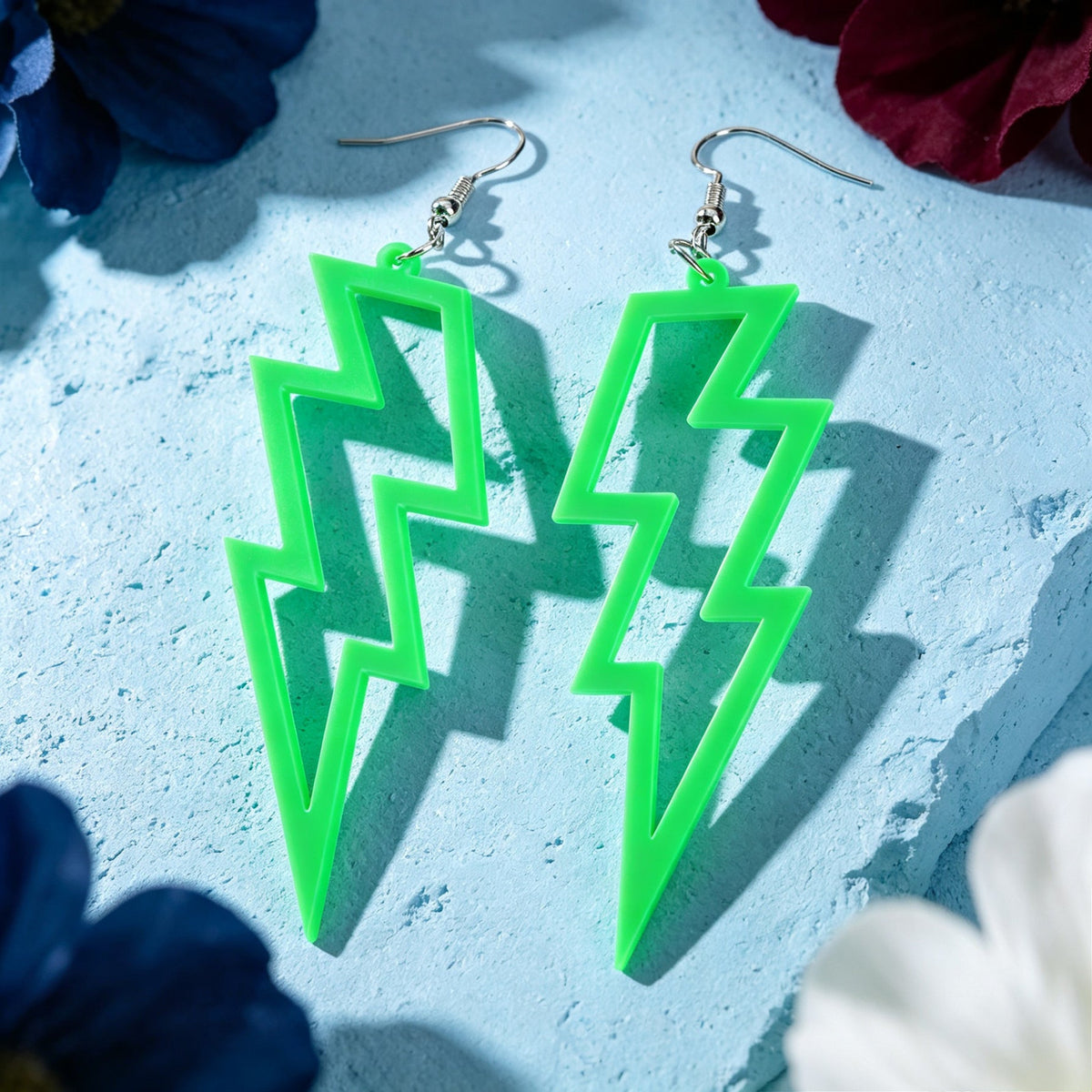 Bright green lightning bolt dangle earrings with silver hooks
