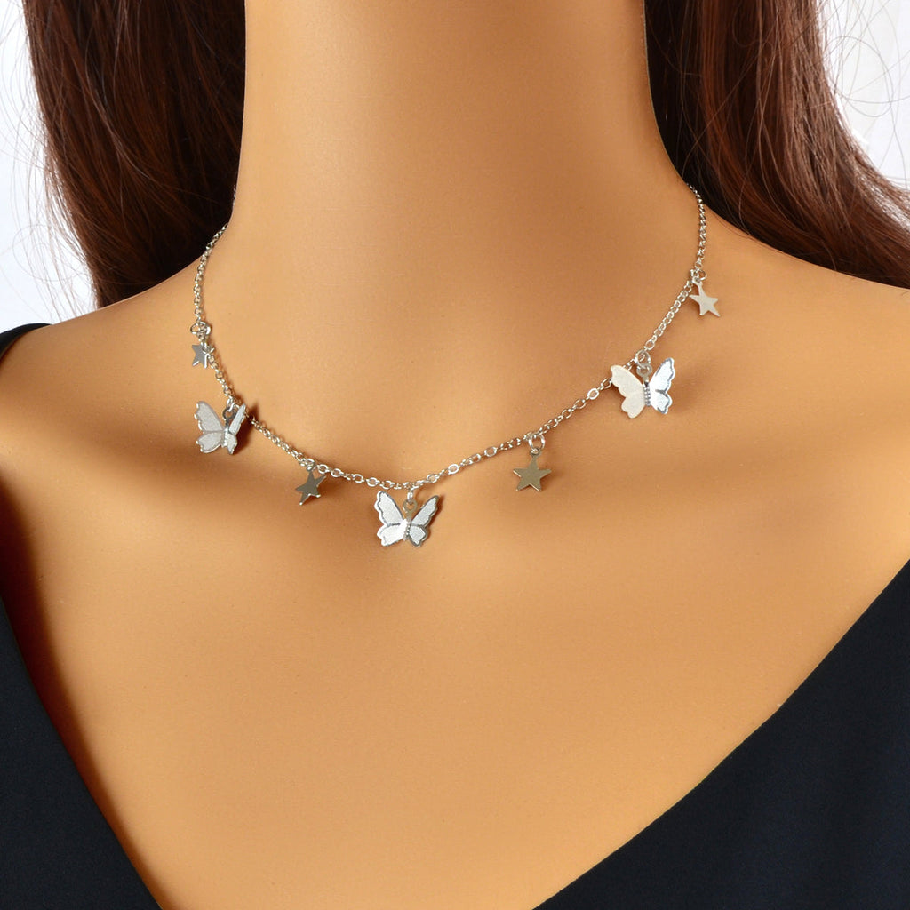 Silver-tone collar necklace with star and butterfly charms, short neckline fit