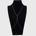 Gold-tone layered body chain harness with Y-shape drape and dangling charms