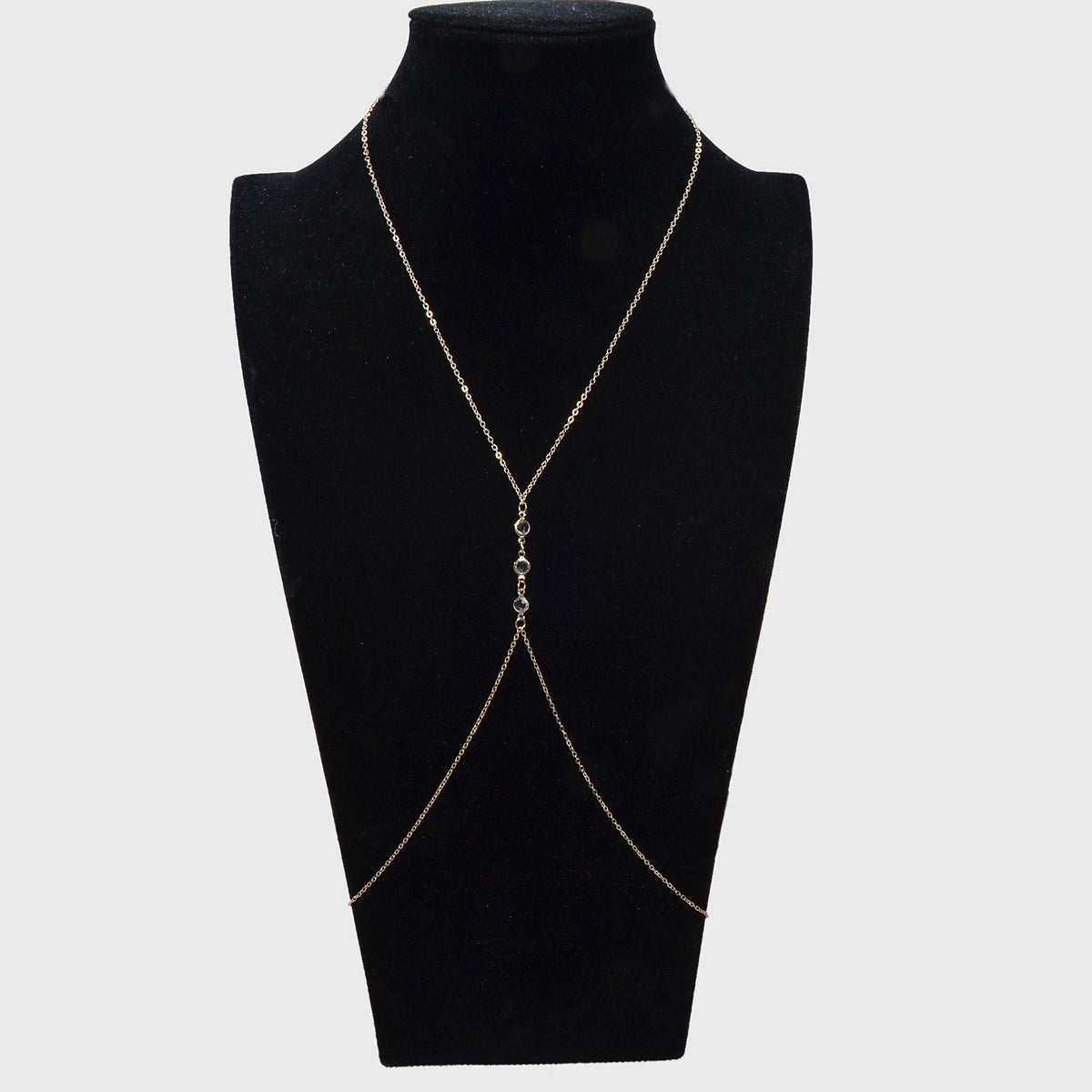 Gold-tone layered body chain harness with Y-shape drape and dangling charms
