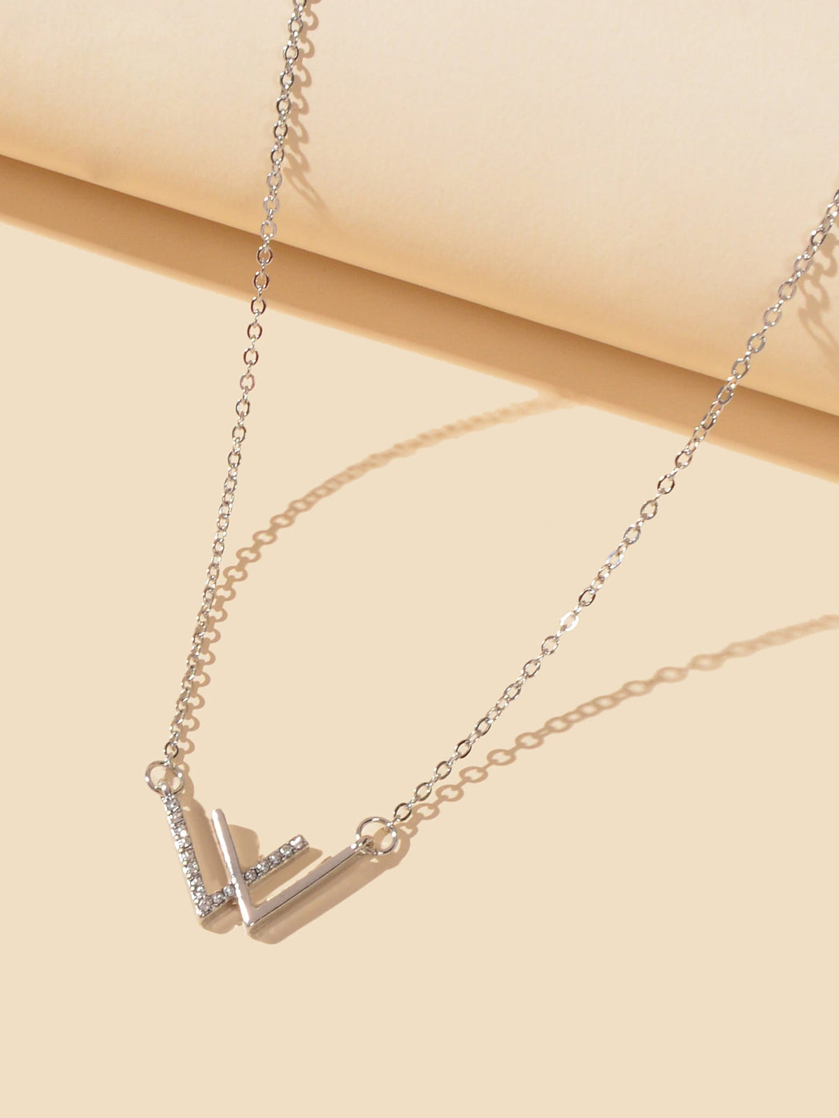 Silver chain necklace with V-shaped rhinestone geometric charm pendant