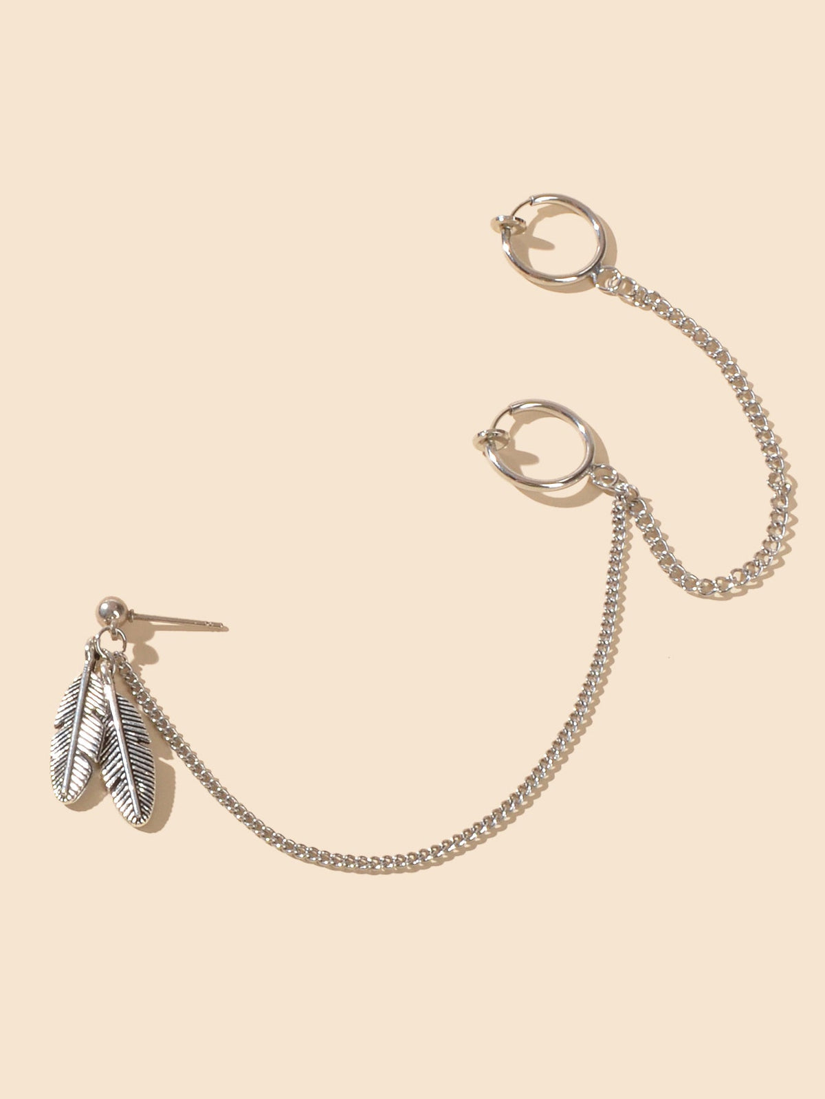 Silver-tone long ear-chain with hoop cuffs and a feather charm