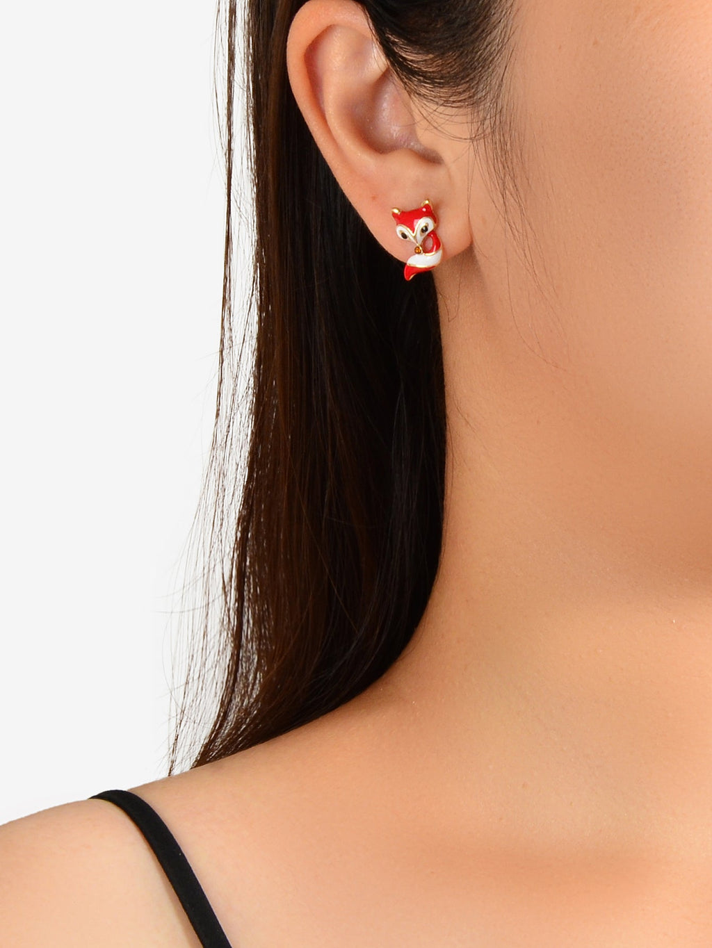 Red fox enamel stud earring on gold-tone post, worn on ear