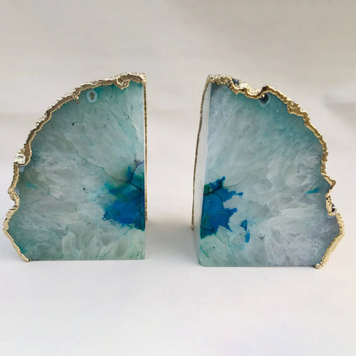 Pair of aqua agate bookends with gold-tone geode edges and teal stone faces