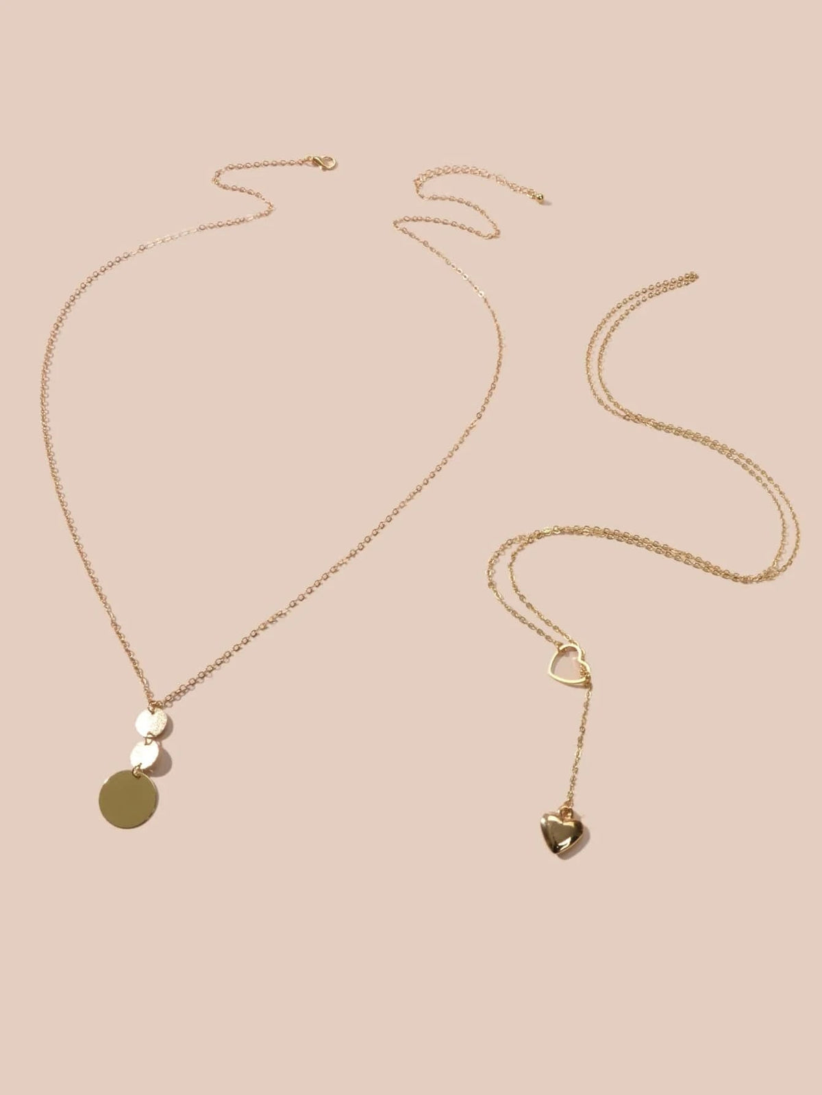 Gold-tone chain necklace set with heart and round disc pendants