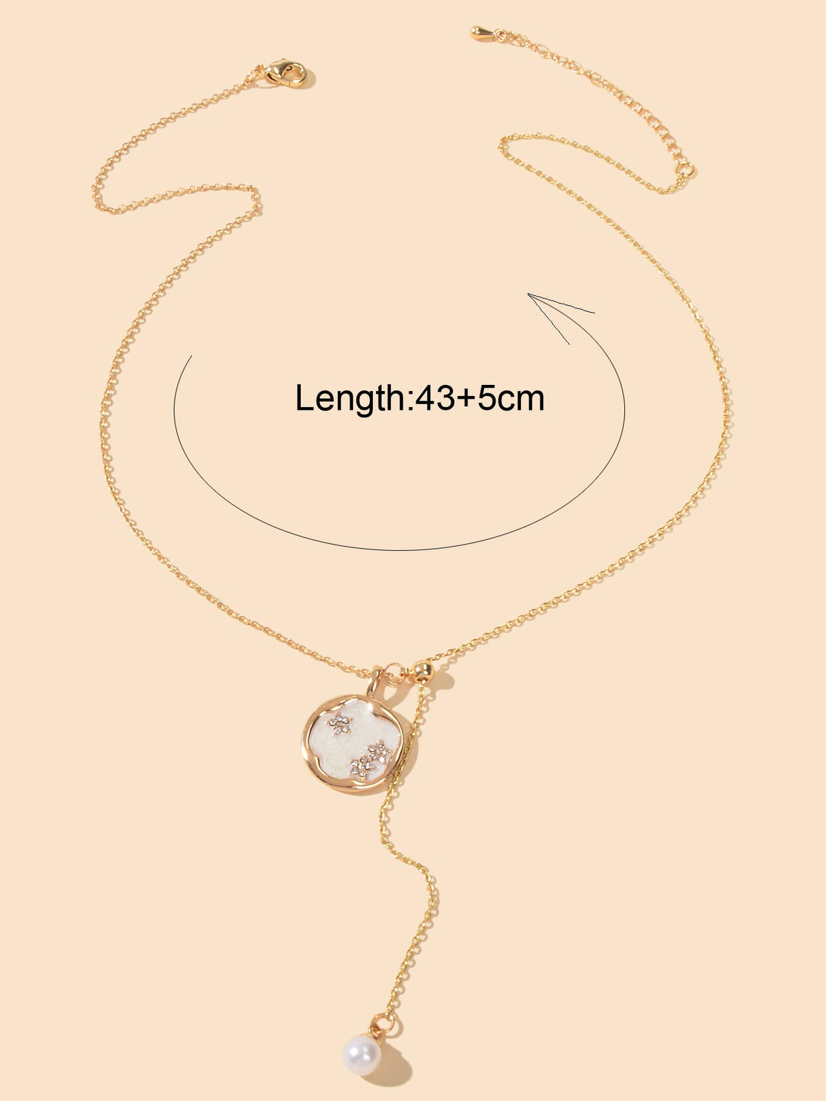 Gold-tone Y necklace with round pendant and hanging pearl drop, adjustable chain
