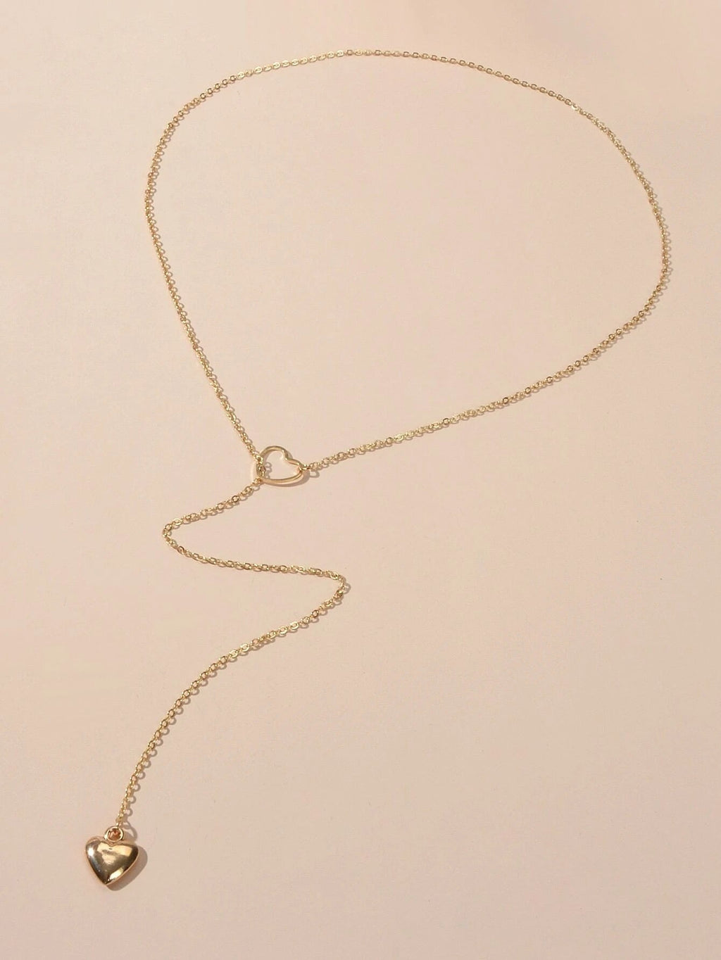 Gold-tone chain necklace with small heart pendant charm