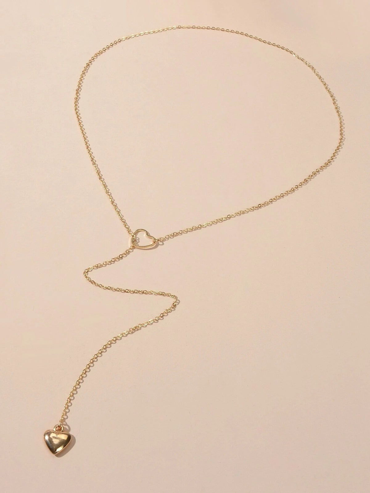 Gold-tone chain necklace with small heart pendant charm