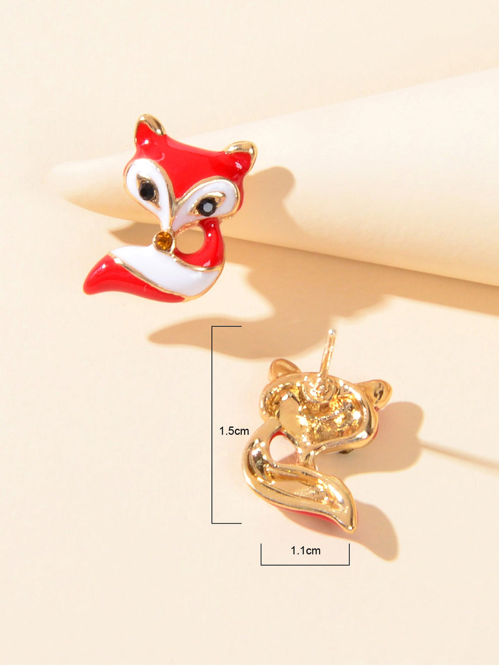 Fox stud earring detail with gold-tone back, size 1.5cm x 1.1cm