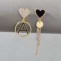 Gold-tone heart and letter A disc charm earrings with rhinestone tassel fringe drops