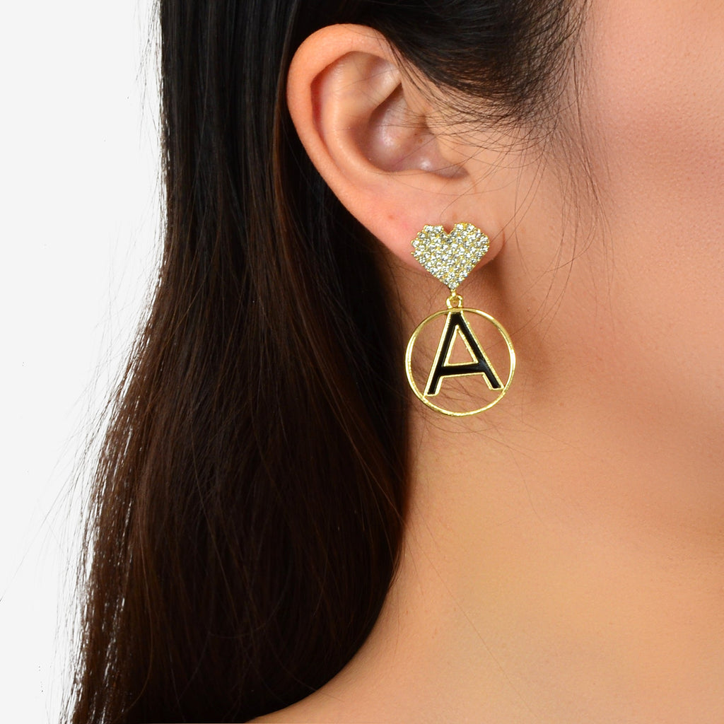 Gold-tone letter A circle disc charm earrings with rhinestone heart stud on ear