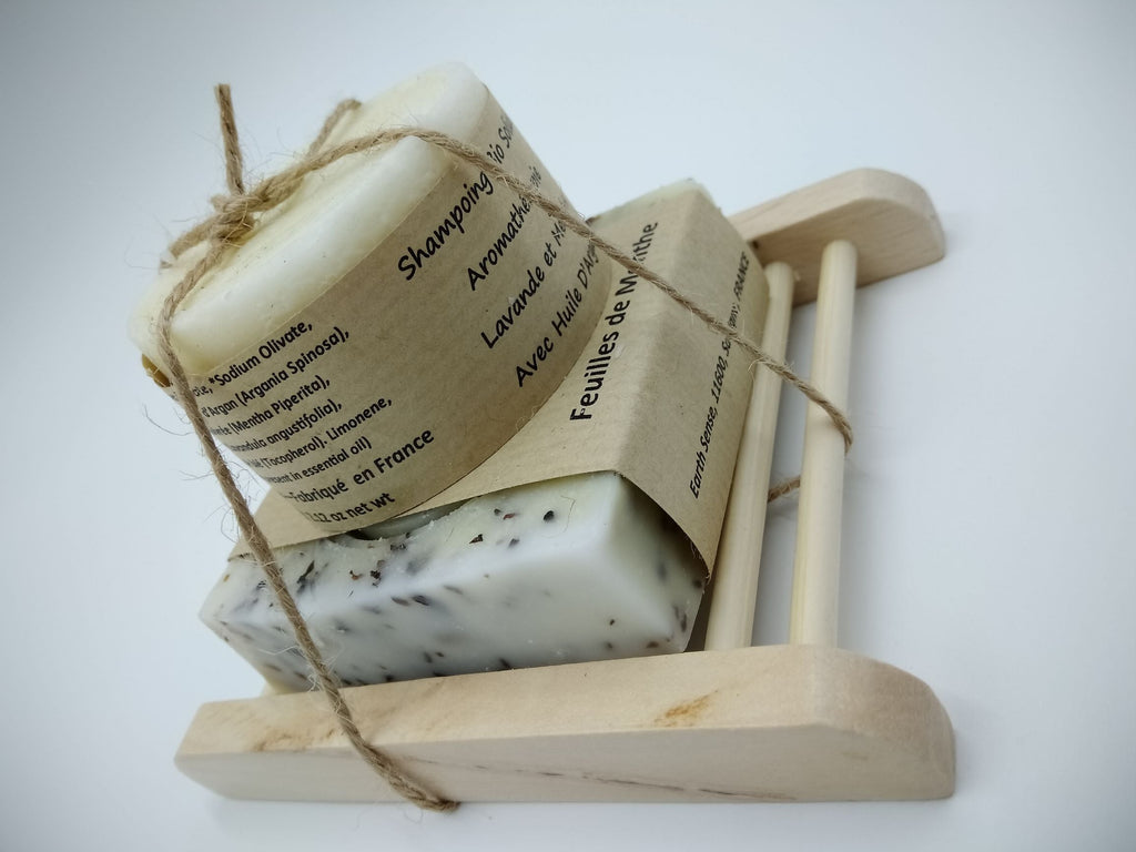 Bamboo soap dish tray holding wrapped soap bars