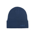Blue knit beanie with ribbed cuff and small stitched logo patch