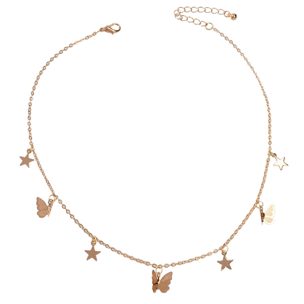 Gold-tone collar necklace with star and butterfly charms, front view