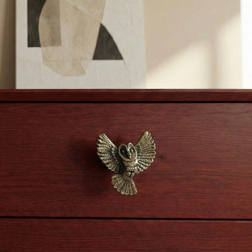 Antique brass owl drawer knob with outstretched wings on short stem