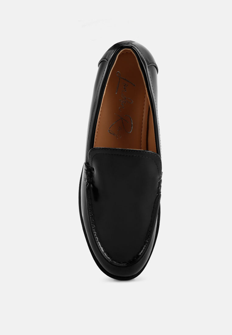 Black pleather loafer heel and interior lining view, stitch detail