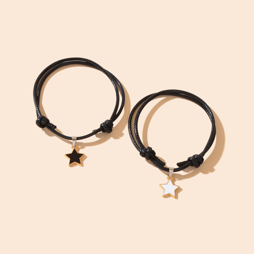 Set of two adjustable black rope friendship bracelets with gold star charms