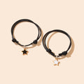 Set of two adjustable black rope friendship bracelets with gold star charms
