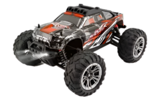 Orange and black off-road RC truck with large knobby tires and chrome front bumper