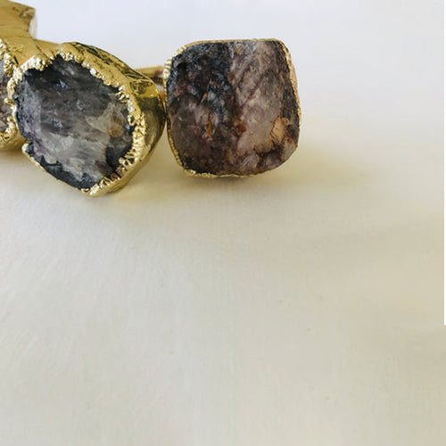 Pair of cabinet drawer pulls with rough amethyst geode stones and gold-tone caps