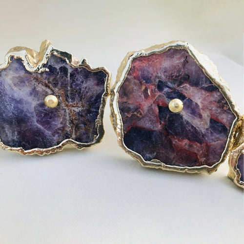 Amethyst slice cabinet knobs with gold-tone pulls and irregular purple-red stone slices