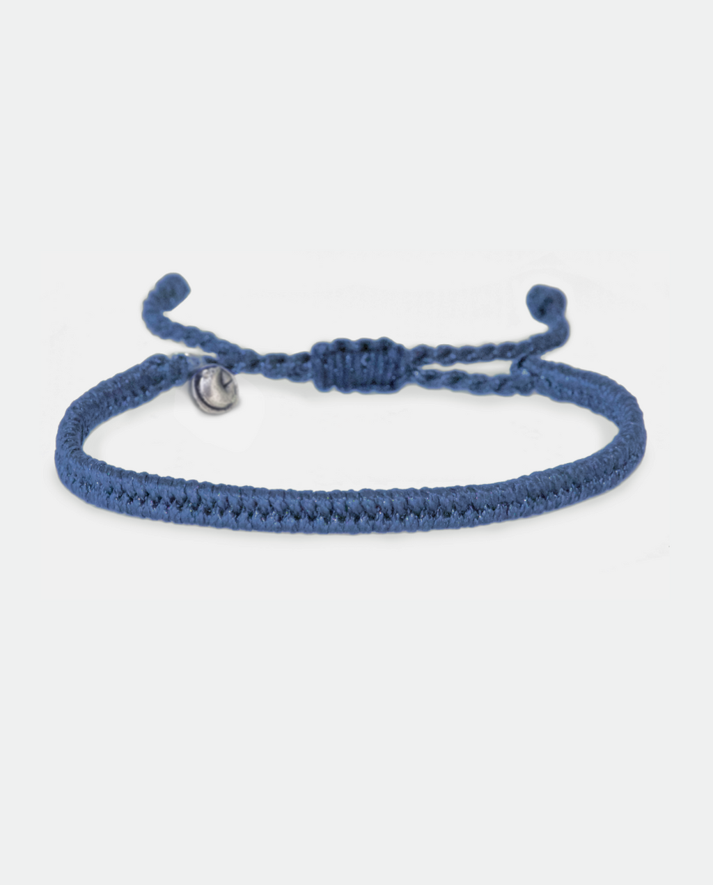 Dark blue braided bracelet with adjustable tie ends and small metal charm