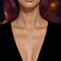 Gold-tone double-layer chain necklace with vertical bar charm and sparkling bead detail