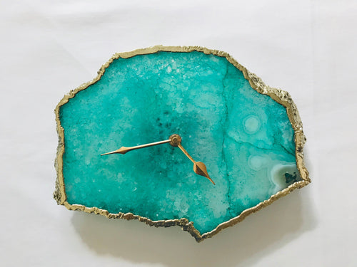 Teal agate wall clock with gold-toned hands and rugged gold bezel