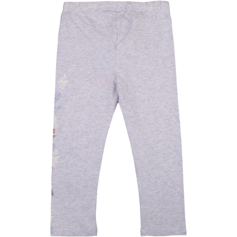 Grey 7/8 leggings with small character graphic near ankle