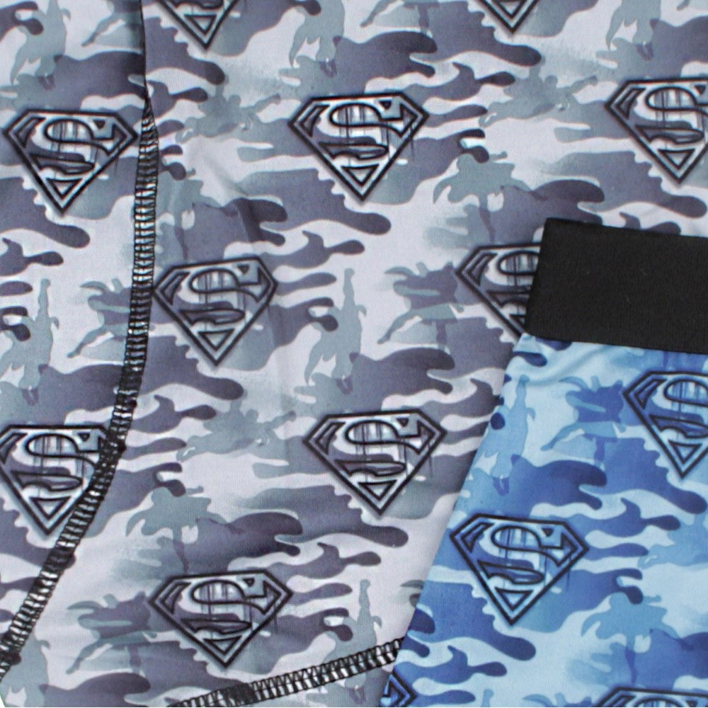 Camouflage boxer briefs fabric close-up with Superman logos and black waistband