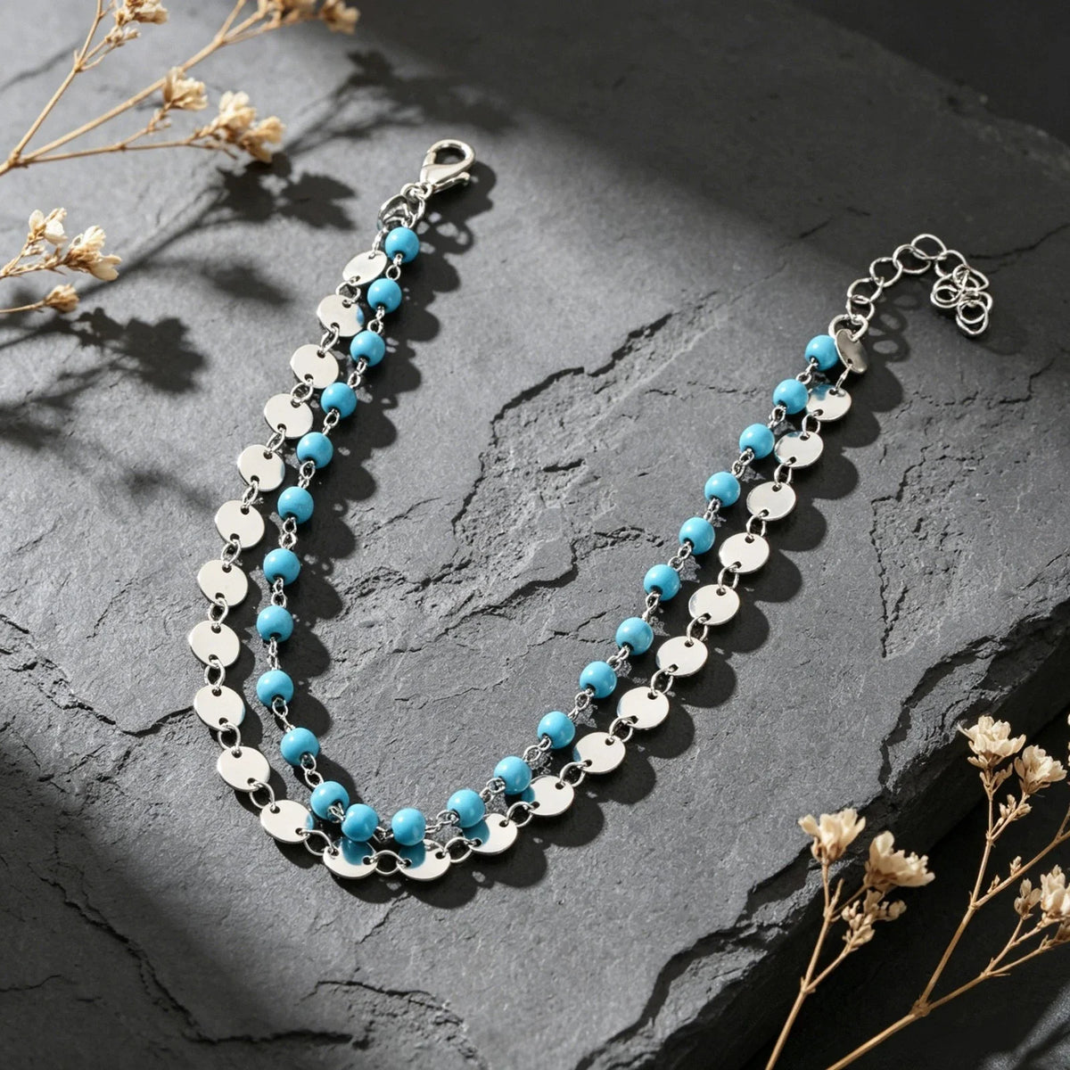 Silver-tone layered anklet with turquoise beads and round disc coin charms