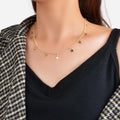 Gold-tone star charm choker necklace with five-point star pendants